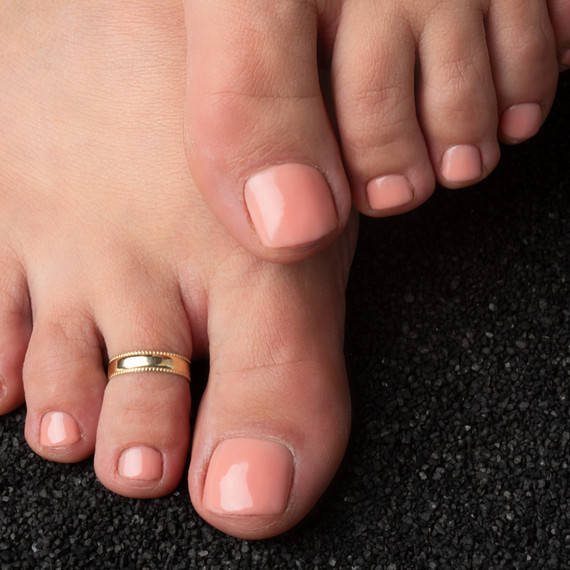 Gold Polished Trendy Toe Ring on female model