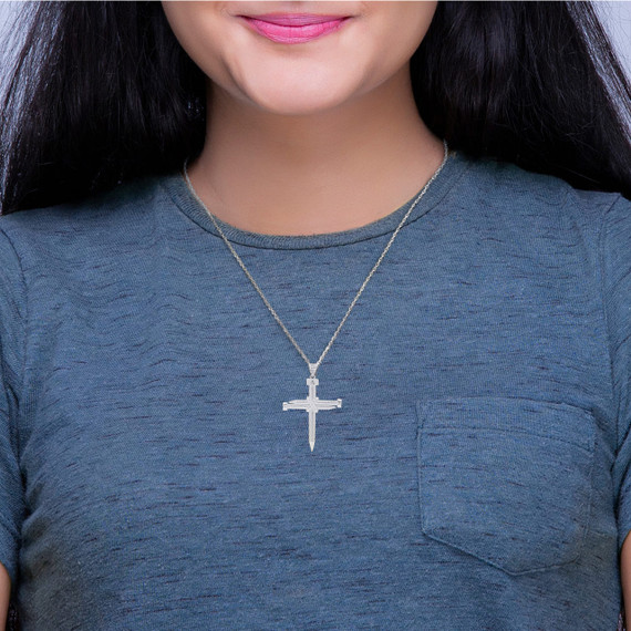 Silver Knotted Nail Cross Small Pendant Necklace on a Model