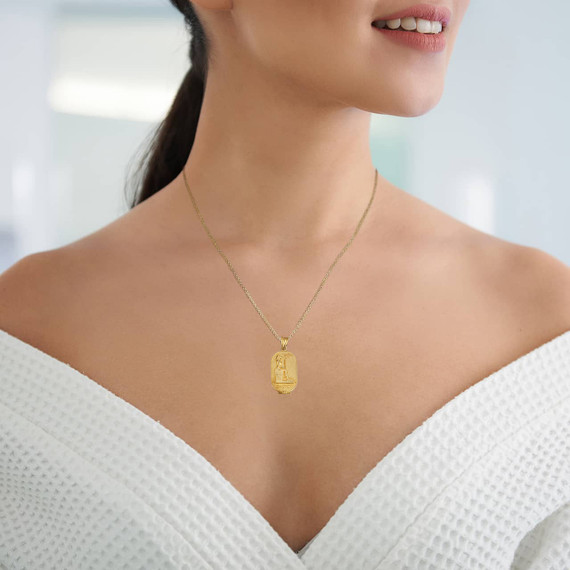 Yellow Gold Beaded Egyptian Goddess Bastet Oval Medallion Pendant Necklace on female model