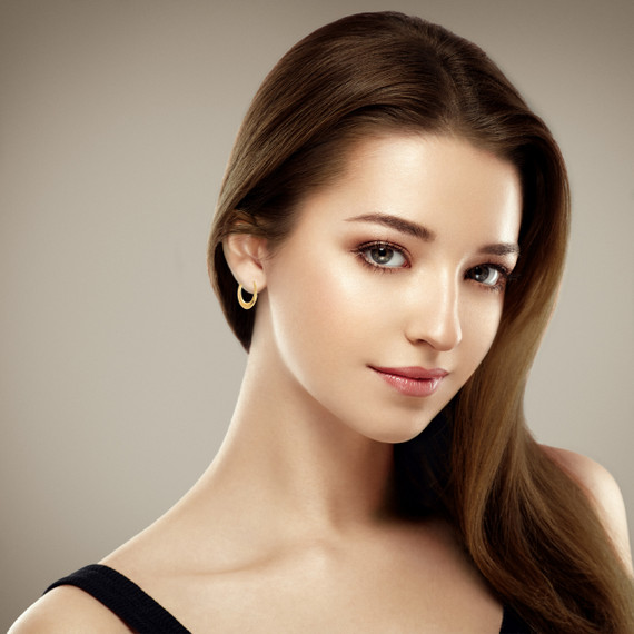 14K Yellow Gold Beaded Reversible Hoop Earrings on female model