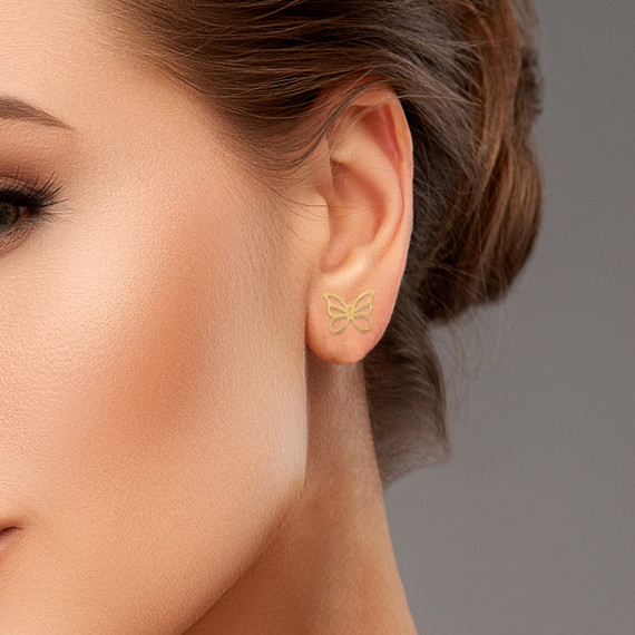 Gold Butterfly Symbol of Change Earrings on female model