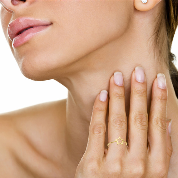 Gold Hugging Hands Ring on female model