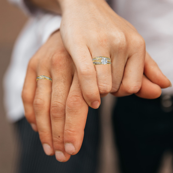Yellow Gold His and Hers Engagement Ring and Wedding Band Set with Cubic Zirconia on models