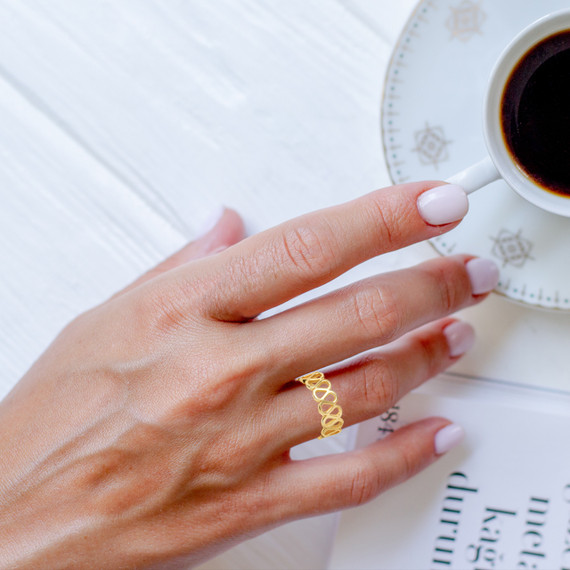 Gold Infinity Teardrop Ring on female model