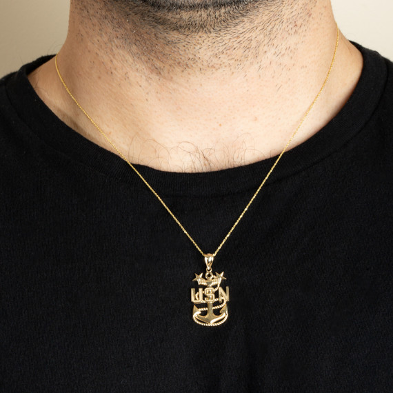 Gold United States Navy Officially Licensed Master Chief Petty Officer Pendant Necklace on male model