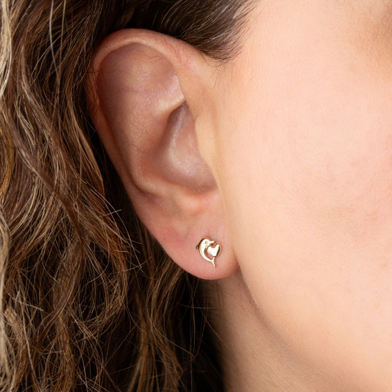 14K Yellow Gold Dolphin Heart Stud Earrings on female model
