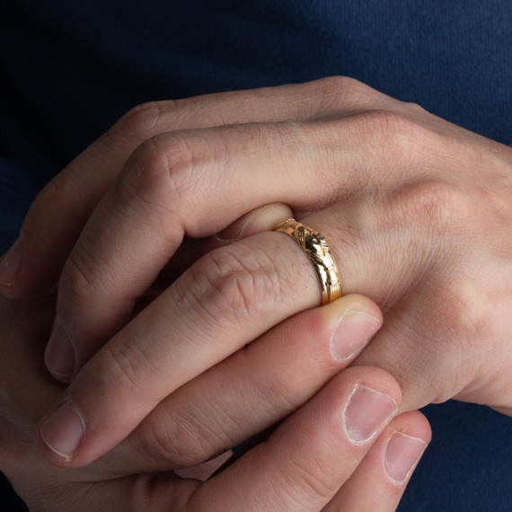 Gold Claddagh Symbol of Love Wedding Ring on male model