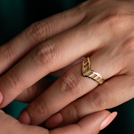 Gold Diamond Cut Striped Chevron Ring on female model