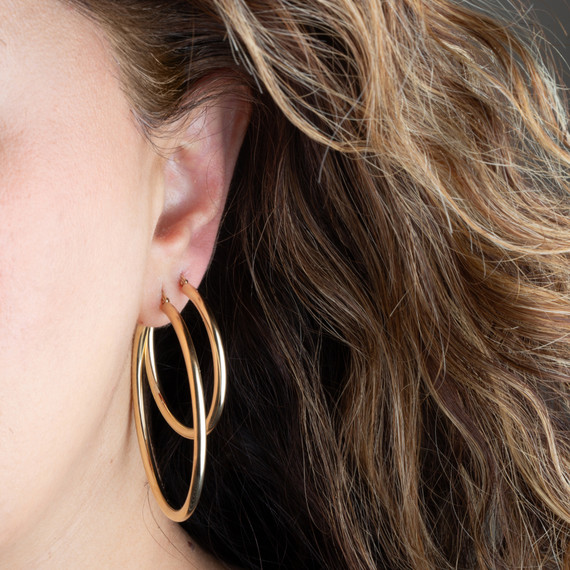 3mm 14K Yellow Gold Hoop Earrings medium and large on female model