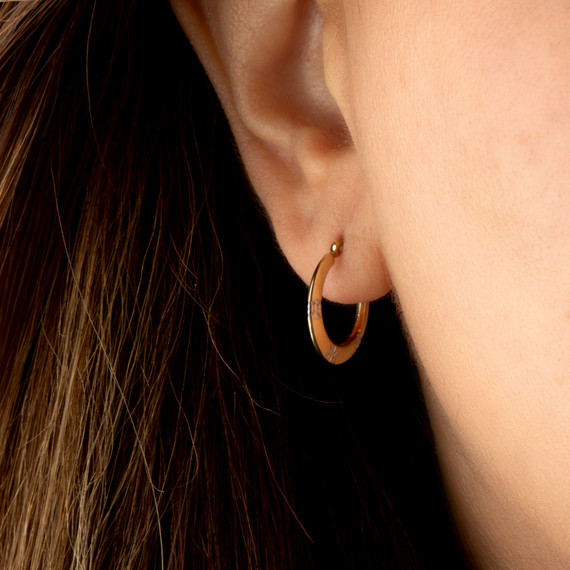 Two-Tone Yellow/White Gold Flower Textured Hoop Earrings on female model