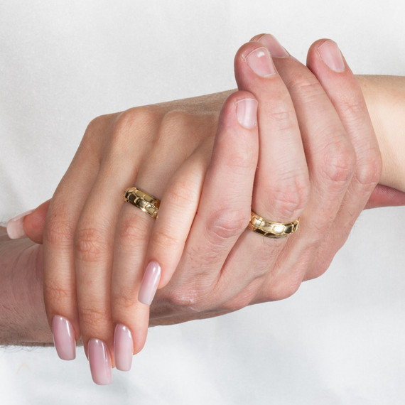 Gold Unisex Nugget Eternity Wedding Band Ring Set on male and female model