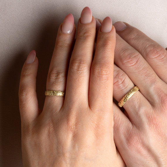 Gold Unisex Textured Irish Celtic Trinity Knot Eternity Wedding Band Ring Set on male and female model