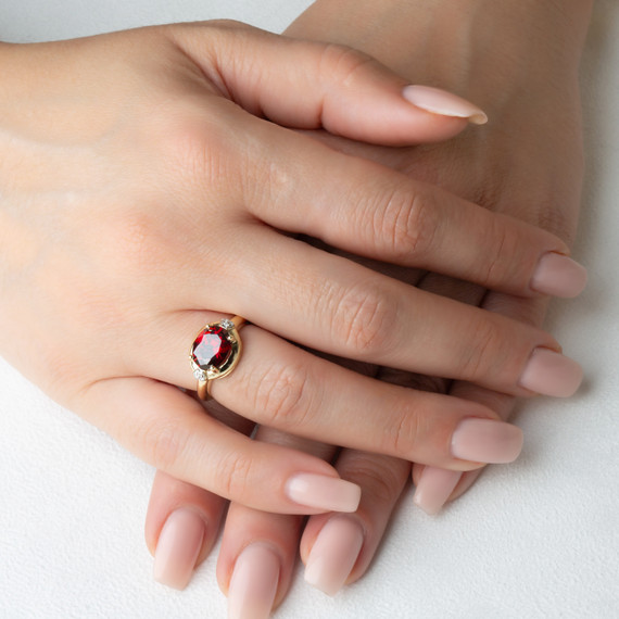 Yellow Gold Oval Garnet Gemstone Diamond Statement Ring on female model