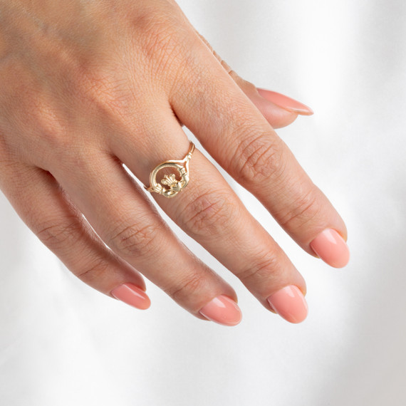 Gold Woman's Claddagh Ring with Cross on female model