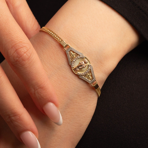 14K Tri-Color Gold 6.5" San Judas Cuban Link Bracelet with Cubic Zirconia on female model