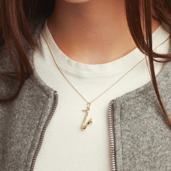 14K Gold Saxophone Music Pendant Necklace on female model