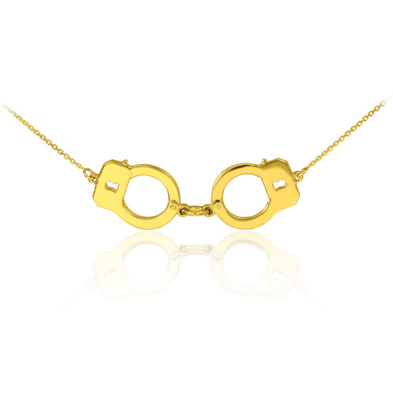 Handcuffs necklace in 14k yellow gold.