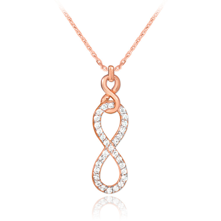 Vertical infinity necklace with clear cubic zirconia in 14k rose gold.