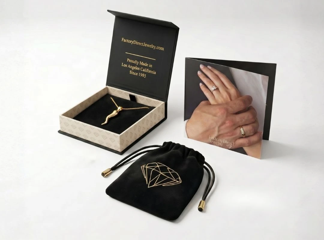 Factory Direct Jewelry signature packaging — black gift box, velvet pouch, and authenticity card