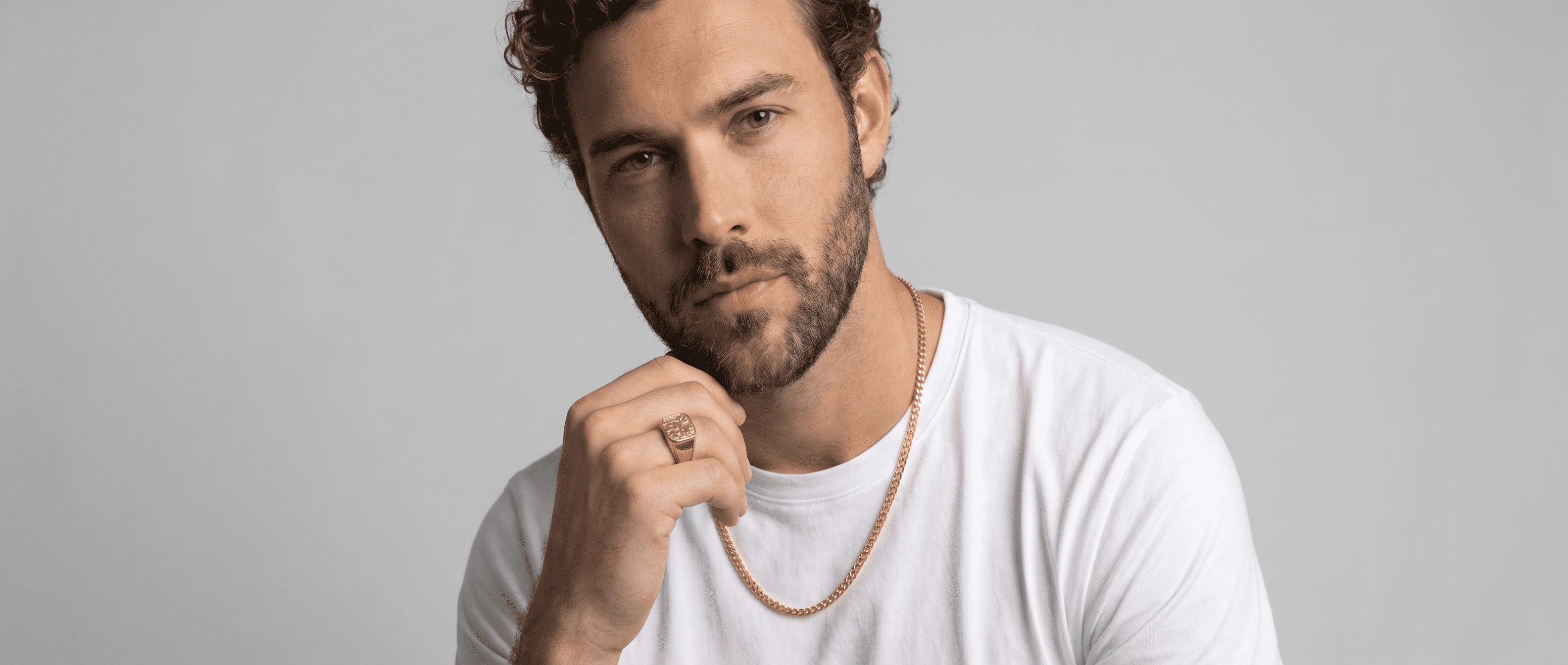 Man wearing gold chain and rings