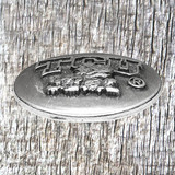 TCU Antiques Silver Concho side view. TCU Antiques Silver Concho side view.