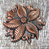Hand rubbed antique copper finish 1-1/2" floral screw back concho. Designed By Sheridan Leather Celebrated Artist Chan Gee.  Front view.