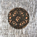 Floral Top 1 Inch Antique Copper Plated Concho - Front view.