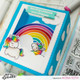 Heffy Doodle Fluffy Puffy Unicorns Stamps example project by Mona Toth uses Rainbow Builder Stencil, Rainbow Builder Coordinating, Head In The Clouds Stencil, Fluffy Puffy Unicorns Stamps and Dies, Bold Banner Coordinating Dies and Big Shadow Box Die.