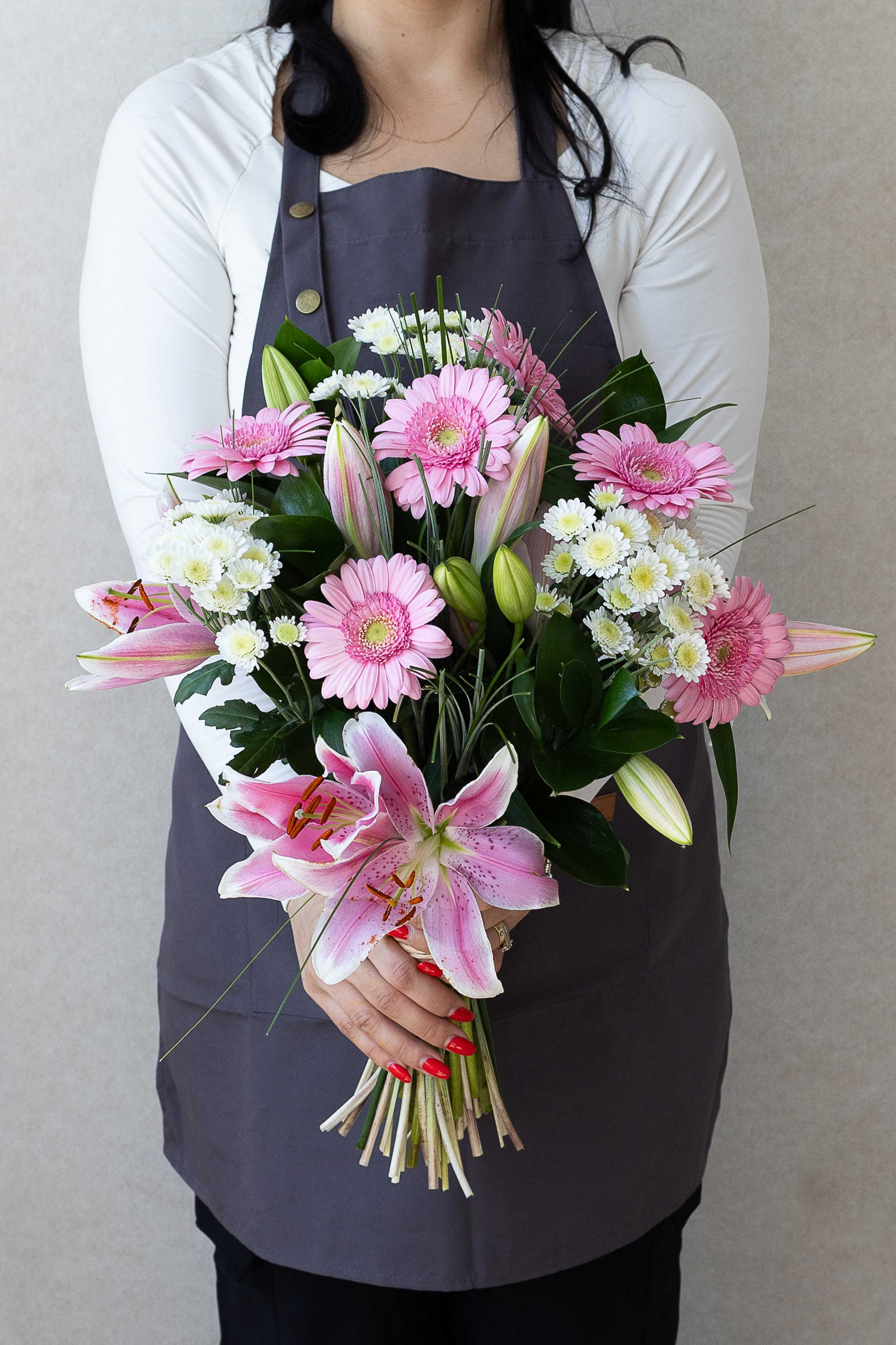 Pink lilies, gerberas and white chrysanthemums bouquet.