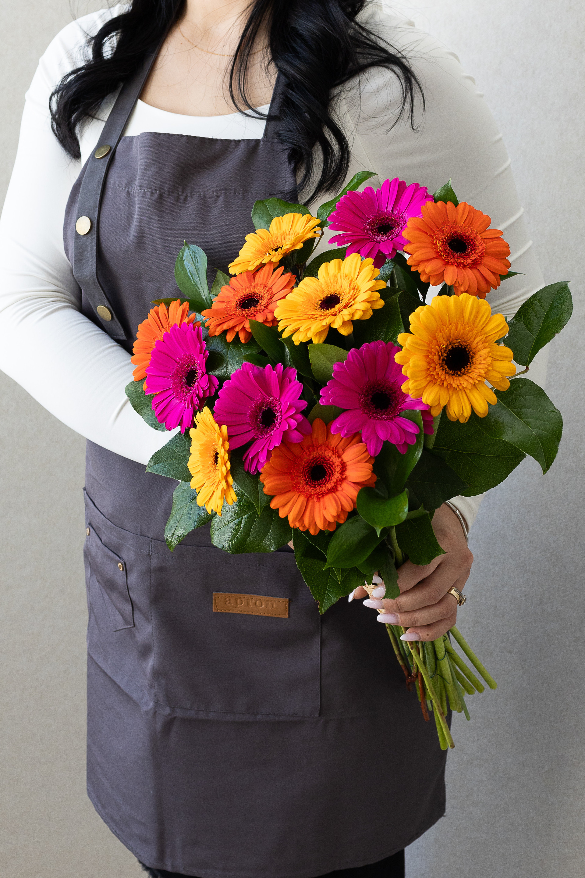 Bright bouquet of pink, orange, and yellow gerberas.
