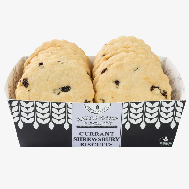Tray of Farmhouse Biscuits Currant Shrewsbury Biscuits, showing round scalloped biscuits with currants in a black-and-white display tray.