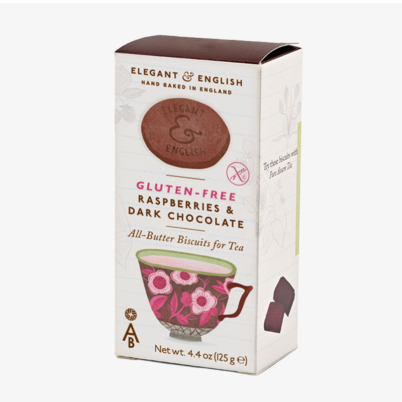 Box of Elegant & English gluten-free raspberries and dark chocolate all-butter biscuits featuring a floral teacup illustration and gluten-free symbol.
