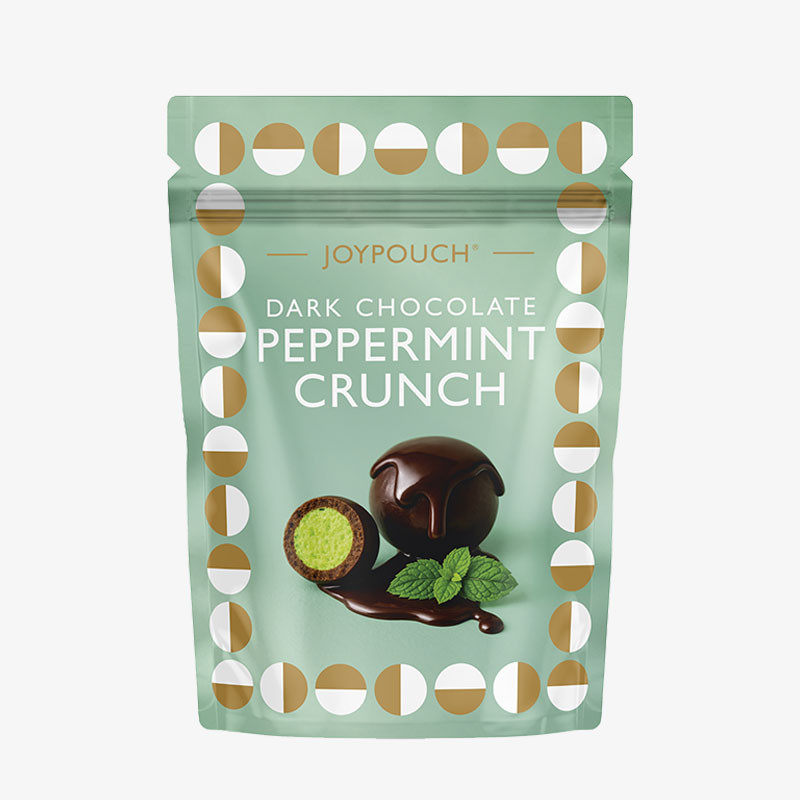 Mint-green JoyPouch Dark Chocolate Peppermint Crunch pouch featuring dark chocolate-coated peppermint treats with a green mint centre.
