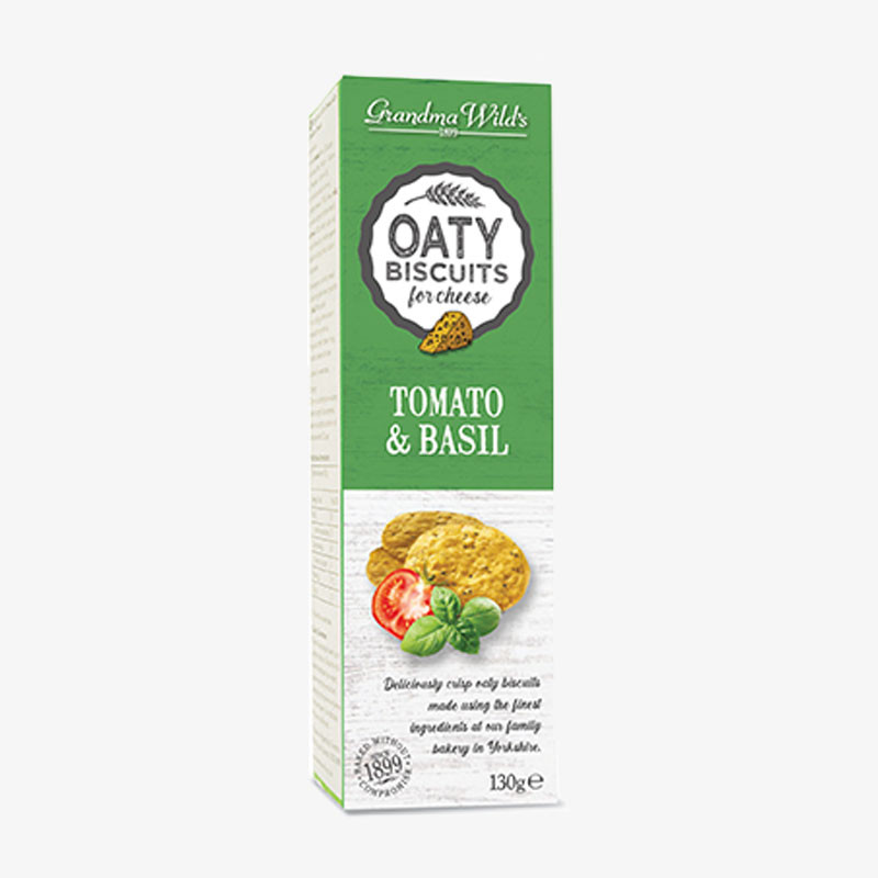Box of Grandma Wild's Oaty Biscuits for Cheese – Tomato & Basil, featuring oat biscuits with tomato and basil on a green and white carton.