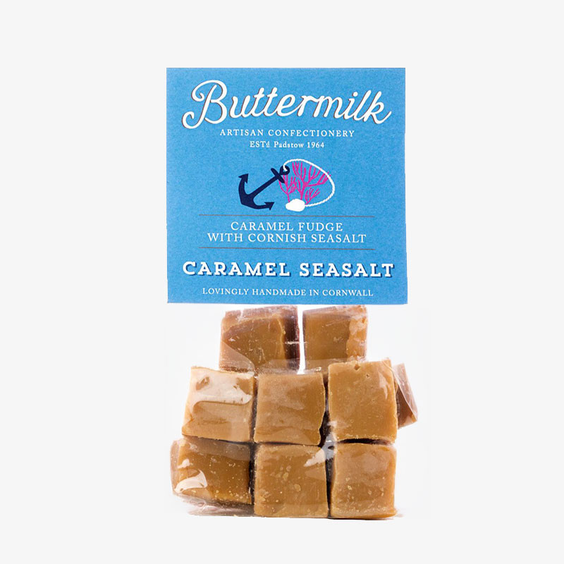 Bag of Buttermilk Caramel Seasalt Fudge with a blue label and visible cubes of handmade Cornish fudge.
