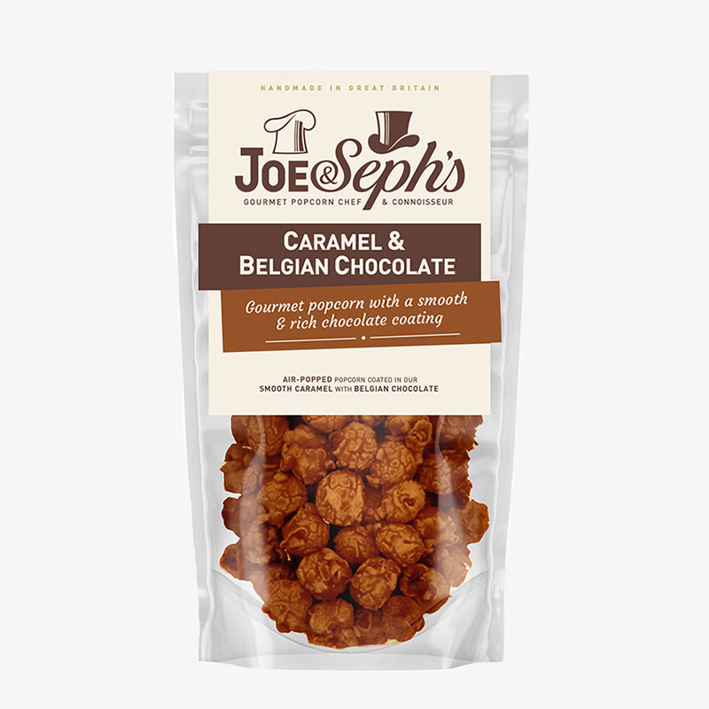 Joe & Seph's Caramel & Belgian Chocolate Gourmet Popcorn in a clear resealable pouch with visible caramel-coated popcorn.