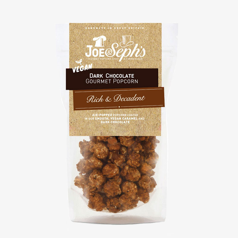 Joe & Seph's Vegan Dark Chocolate Gourmet Popcorn in a clear resealable pouch with visible chocolate-coated popcorn.