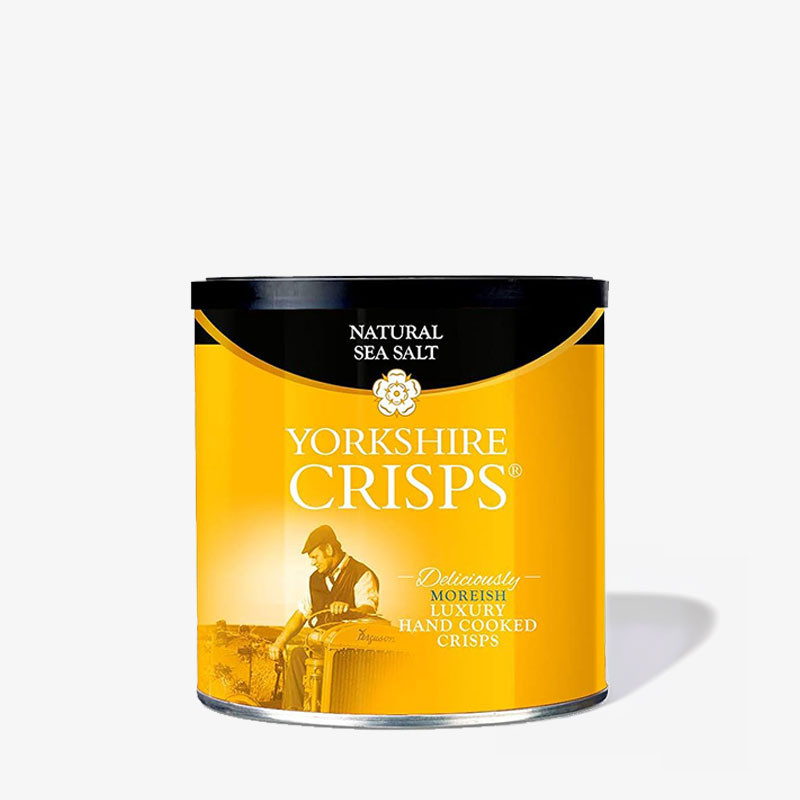 Golden-yellow Yorkshire Crisps Natural Sea Salt tin featuring a tractor image and luxury hand-cooked crisps branding.