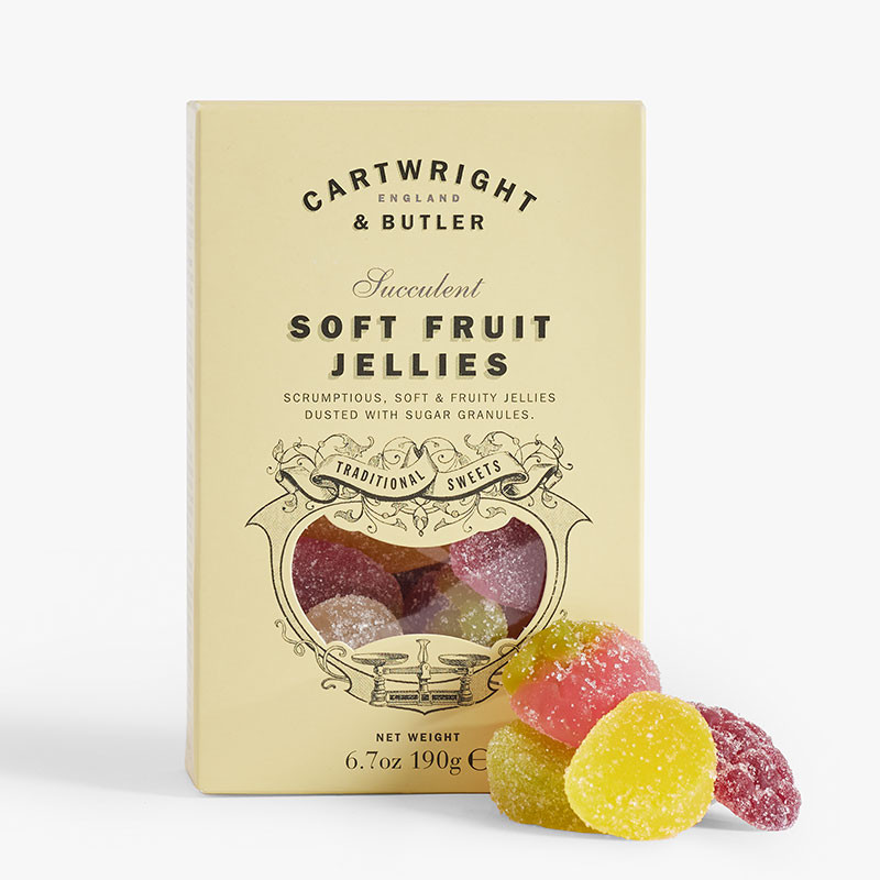 Cream-coloured box of Cartwright & Butler Succulent Soft Fruit Jellies with a window showing assorted sugar-coated fruit jellies and four sweets displayed in front.