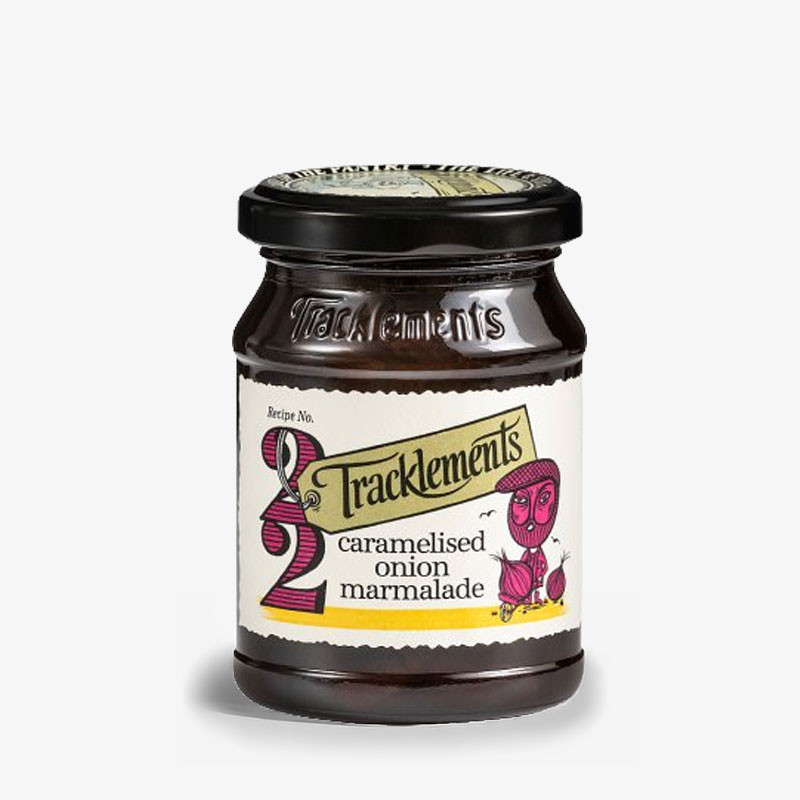 Jar of Tracklements Caramelised Onion Marmalade with cream illustrated label and black lid.