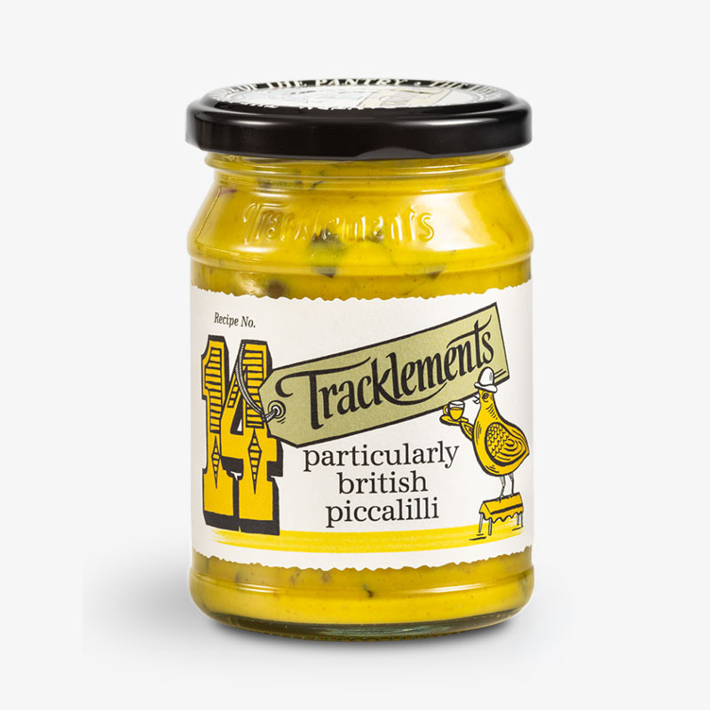 Jar of Tracklements Particularly British Piccalilli with cream illustrated label and black lid.