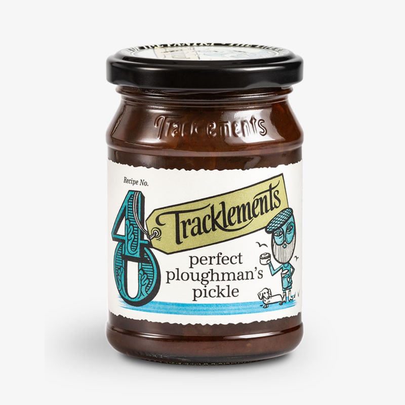 Jar of Tracklements Perfect Ploughman’s Pickle with illustrated cream label and black lid.