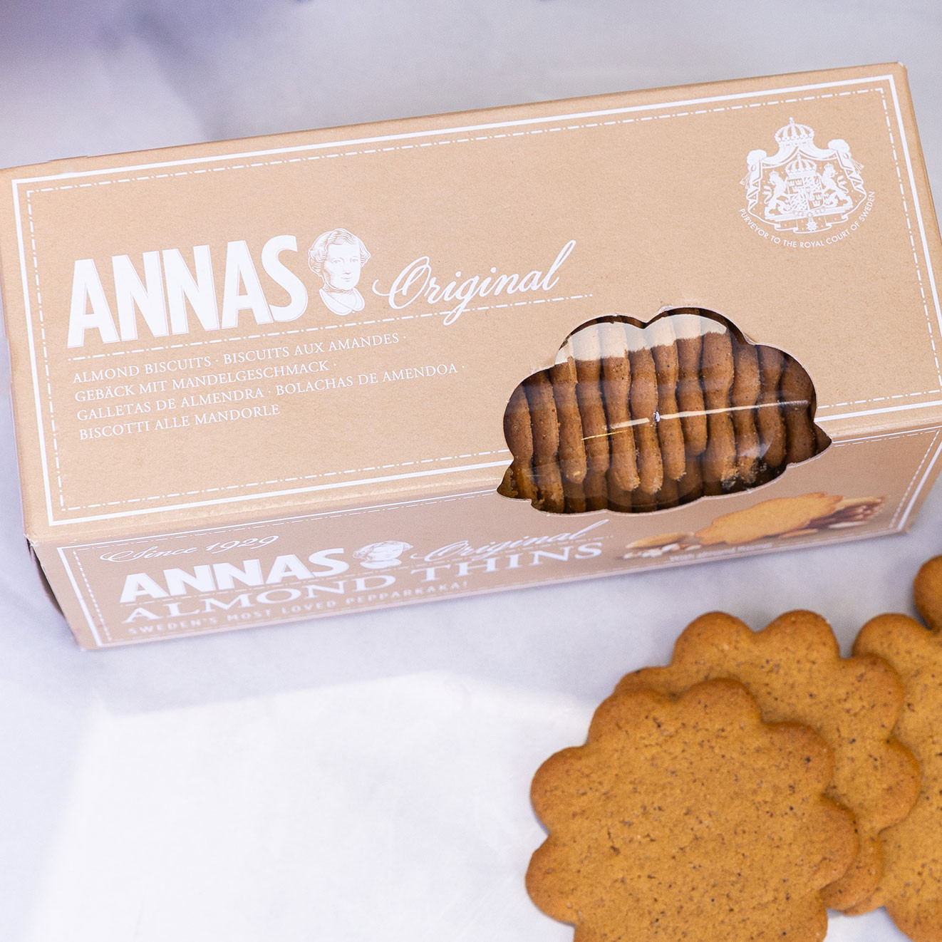 Box of Anna's Original Almond Thins biscuits displayed with almond biscuits alongside.