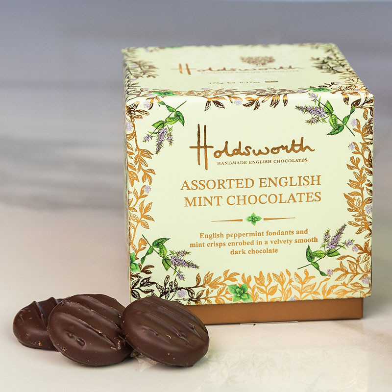 Holdsworth Assorted English Mint Chocolates presented with smooth dark chocolate mint creams on a marble surface.