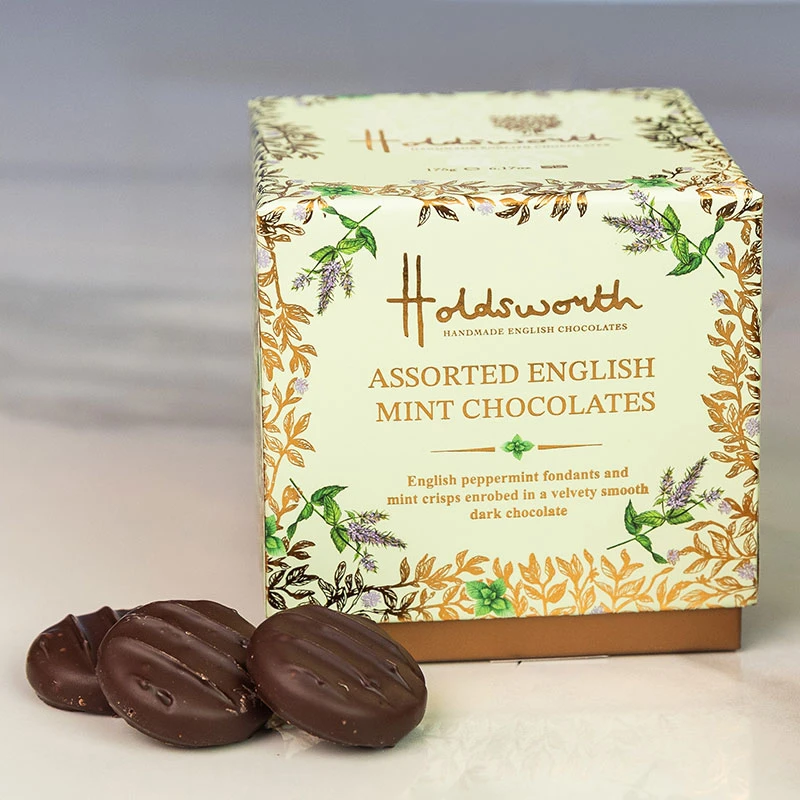 Holdsworth Assorted English Mint Chocolates presented with smooth dark chocolate mint creams on a marble surface.