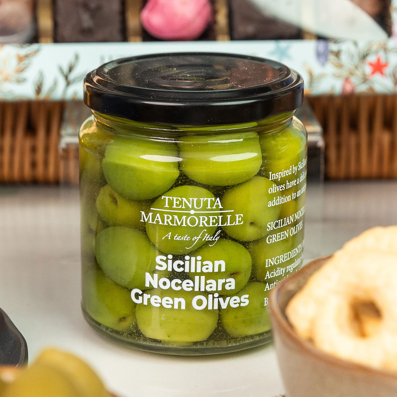 Tenuta Marmorelle Sicilian Nocellara Green Olives in a premium glass jar, ideal for sharing.