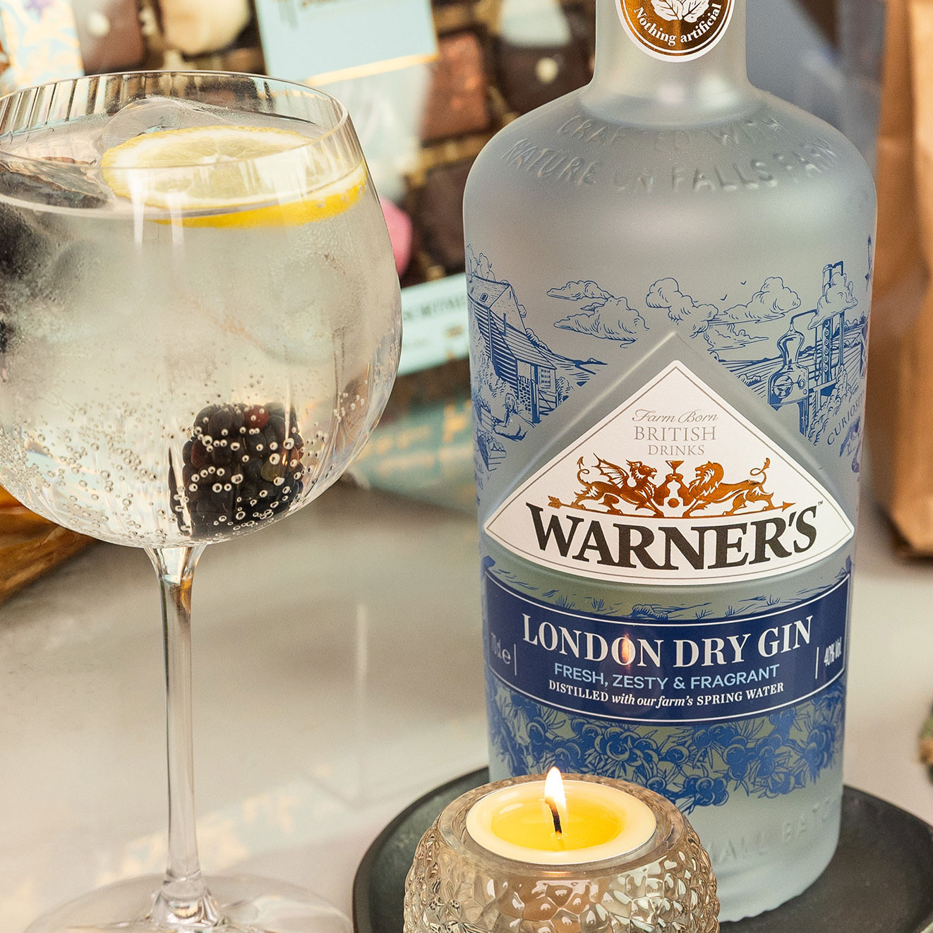Warner's London Dry Gin served with premium tonic, ice, lemon and fresh berries for a classic gin and tonic.