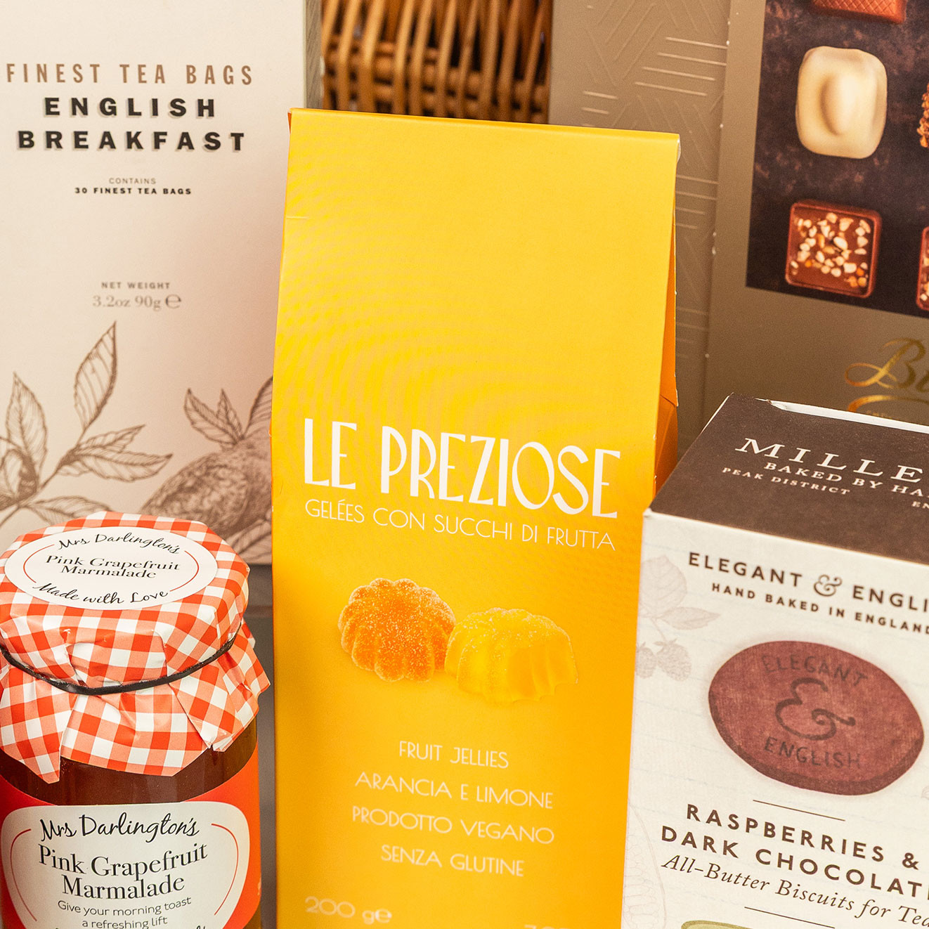 Le Preziose Italian fruit jellies displayed with English breakfast tea, pink grapefruit marmalade and raspberry chocolate biscuits.
