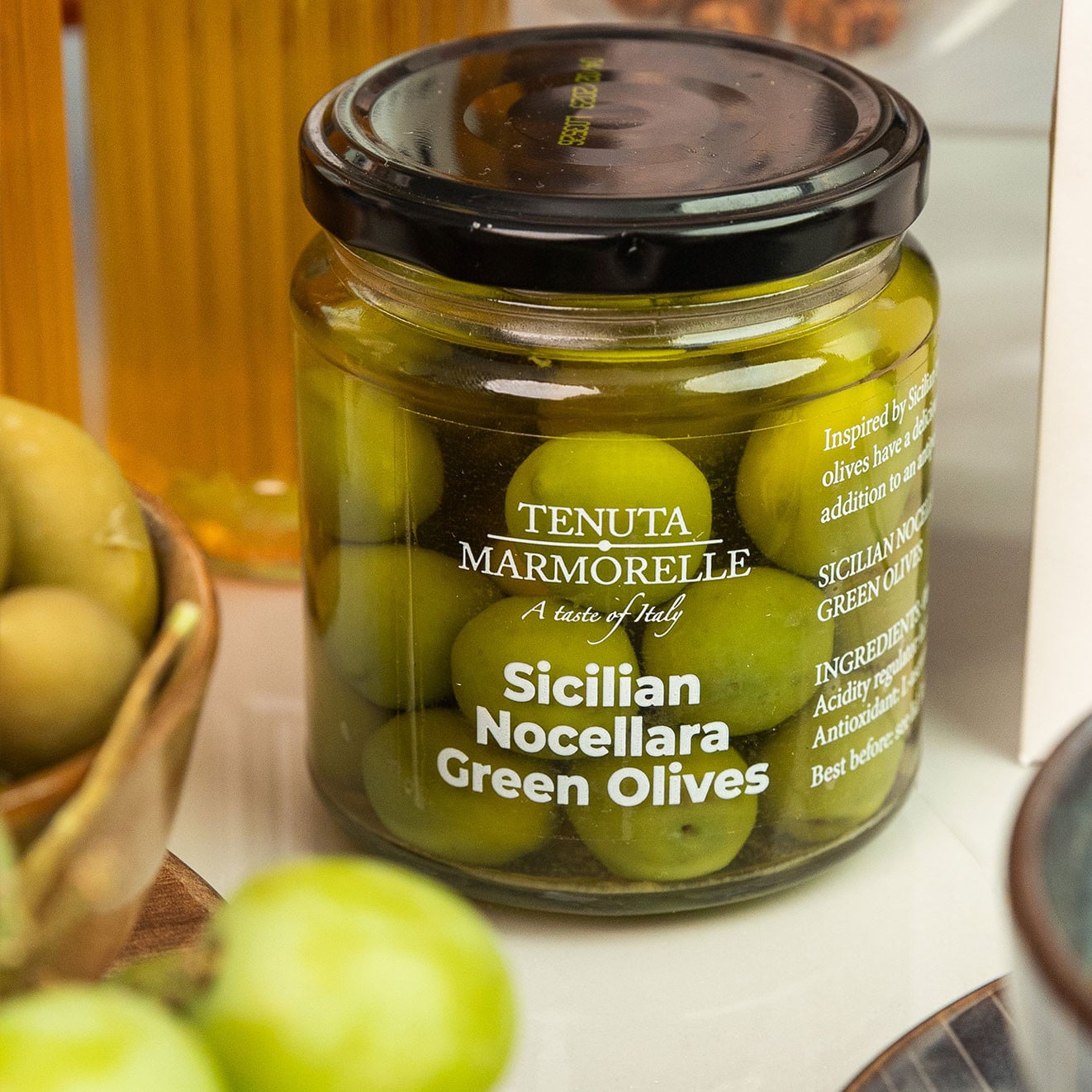 Jar of Tenuta Marmorelle Sicilian Nocellara Green Olives, ideal for charcuterie boards and Mediterranean-inspired grazing.