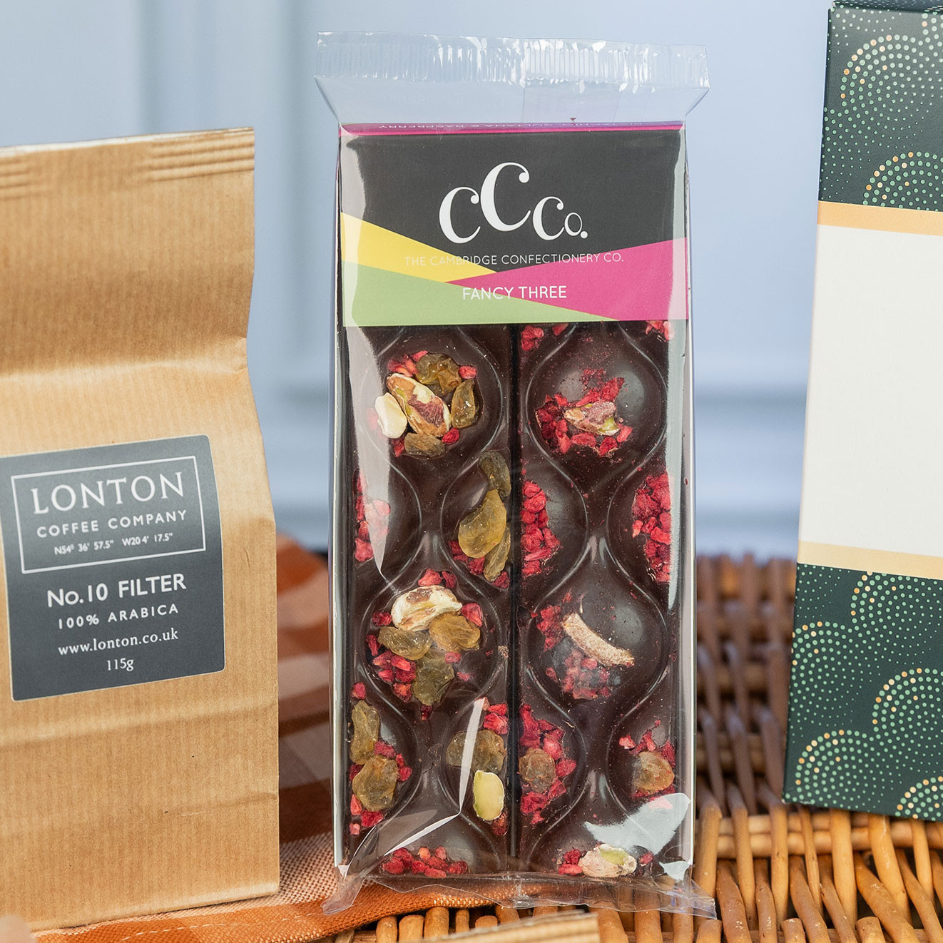 Cambridge Confectionery Co. Fancy Three artisan chocolate bar topped with pistachios, raisins and freeze-dried berries.